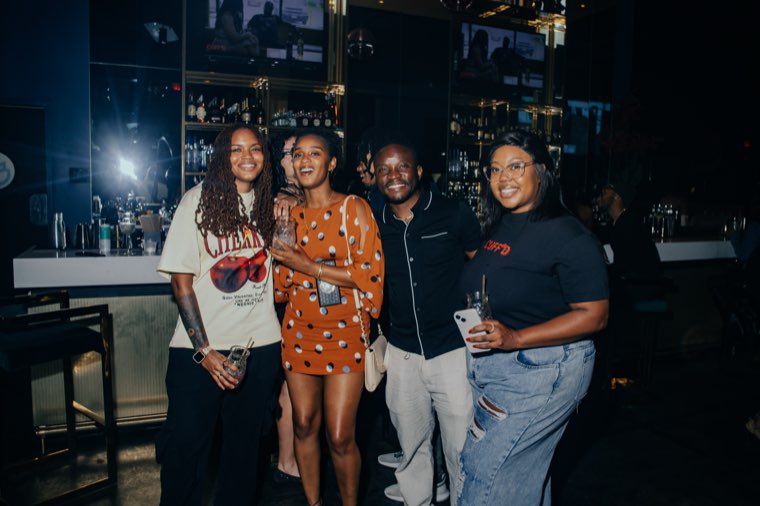 Group of singles connecting at the bar during Speed Vibin'