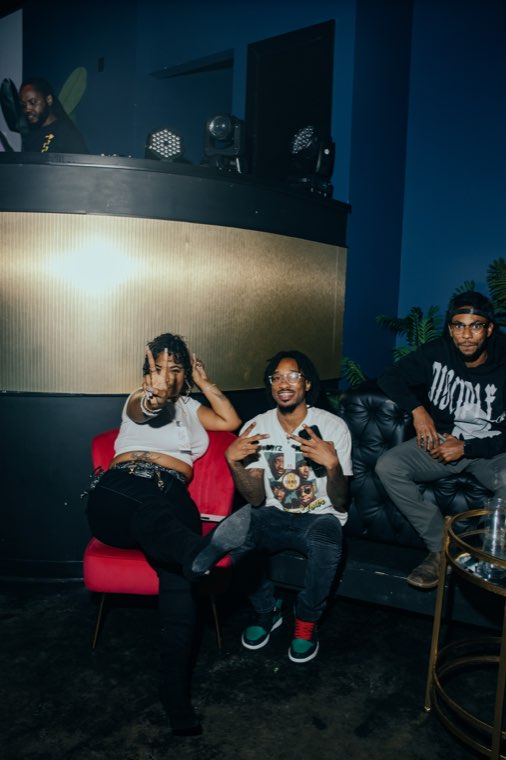 Group hanging out on the couch at the event
