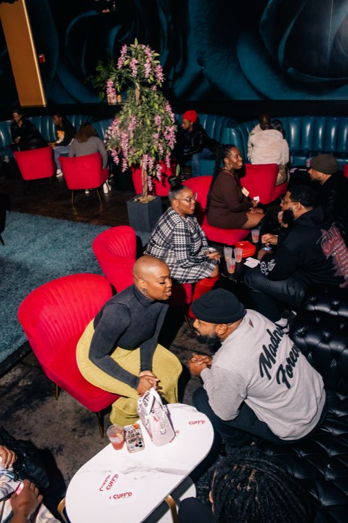 Guests seated at tables during Speed Vibin'